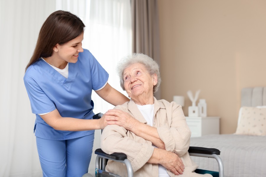 Staff assisting resident with daily activities